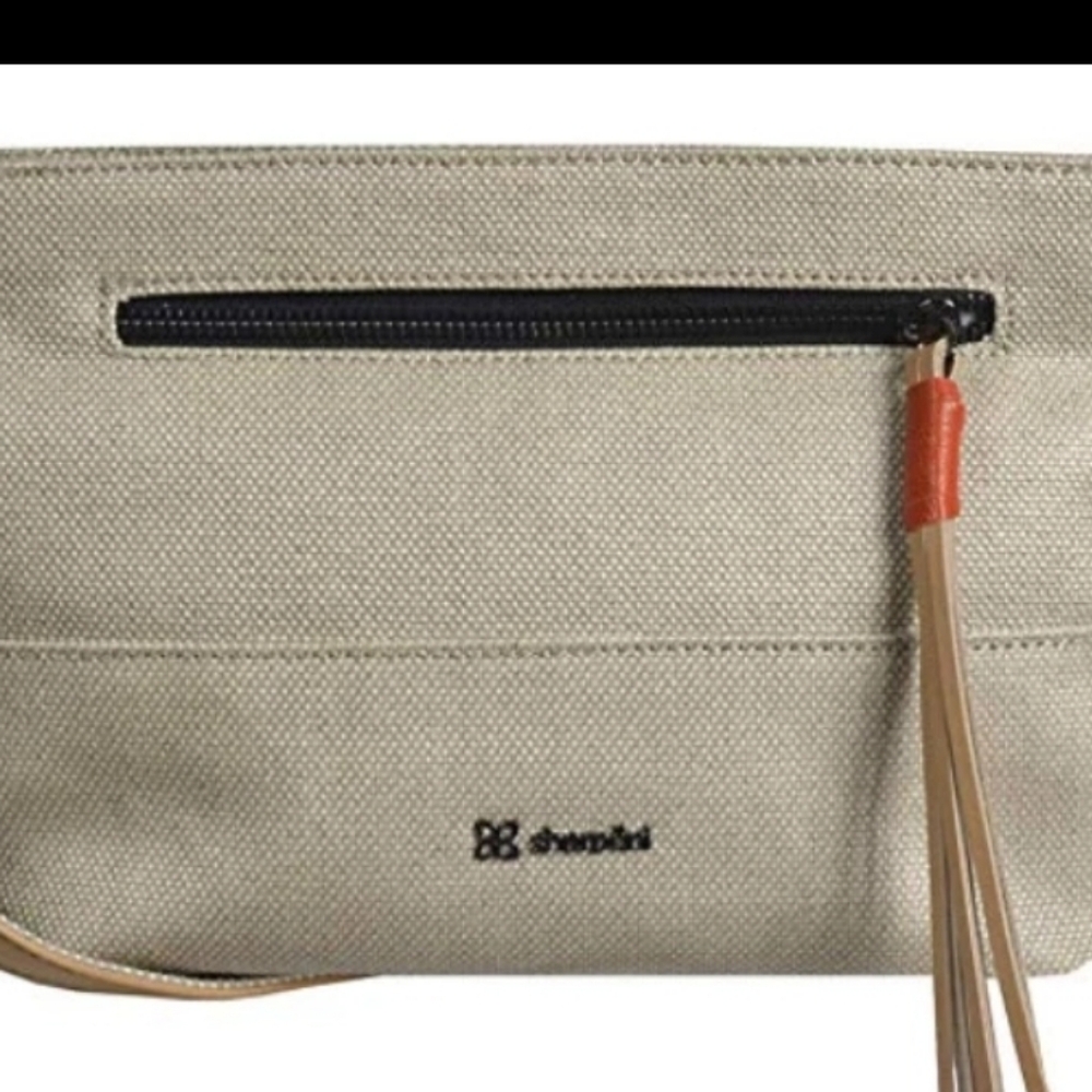 Sherpani Beige Wristlet with Tassel Accent